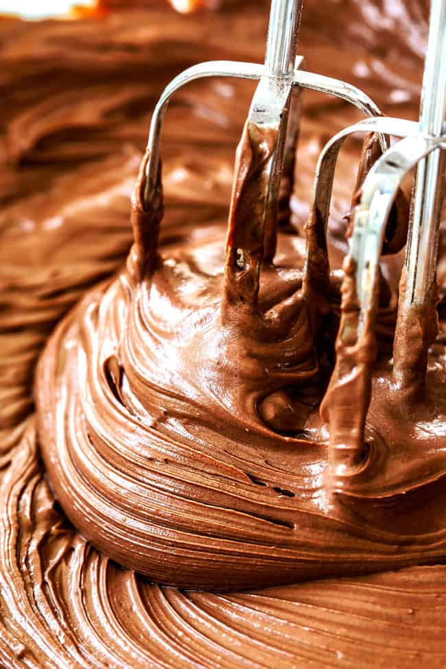 showing how to make banana cake by beating frosting