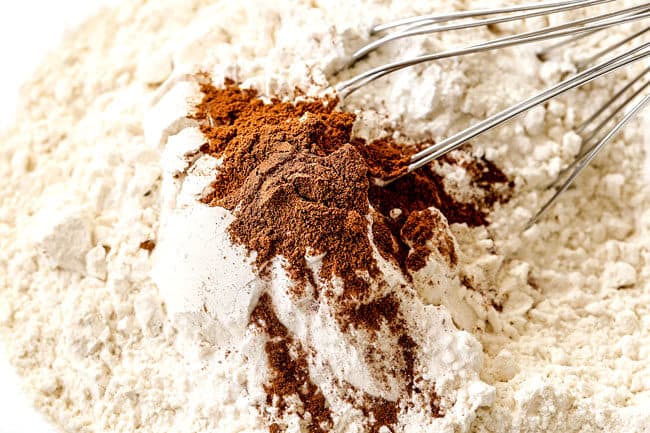 showing how to make banana cake by whisking dry ingredients together