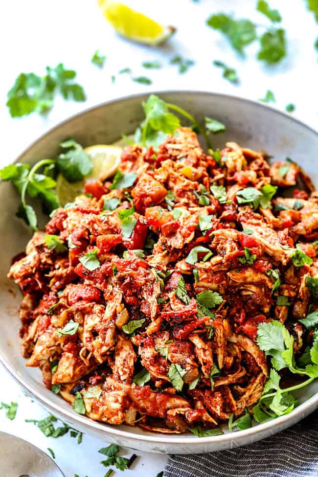 side view of authentic Mexican Chicken in a white bowl