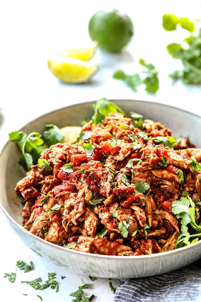 side view of authentic Mexican Chicken in a white bowl