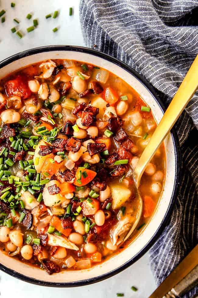 up close of a bowl of easy navy bean and ham soup with potatoes