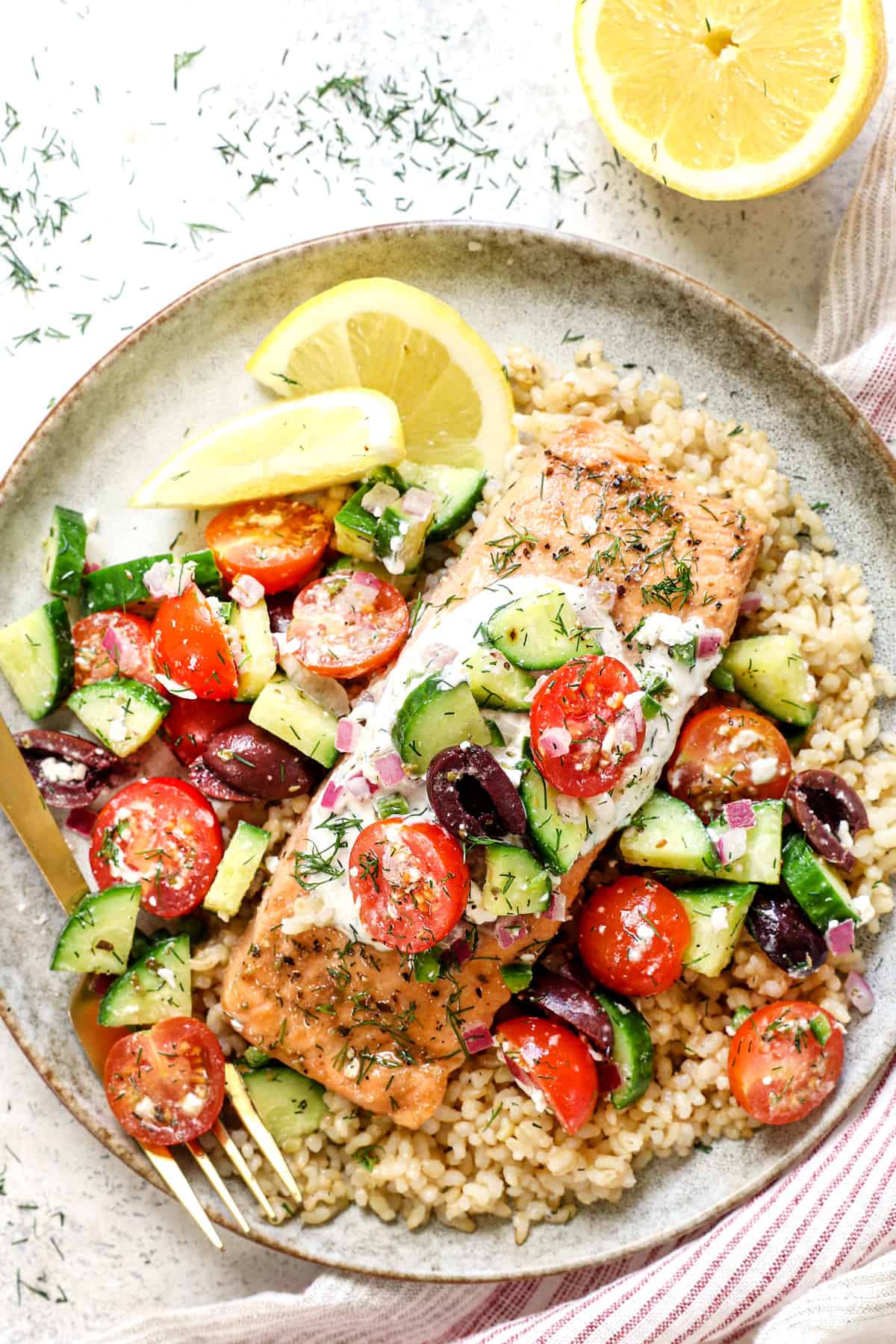 top view of serving dill salmon recipe on a plate with a side of lemon rice