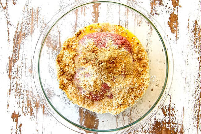 showing how to make cranberry meatballs by combining lean ground beef, eggs, seasonings and milk in a glass bowl