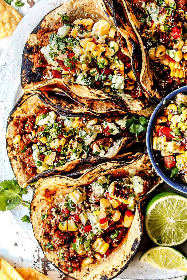 top view of pork tacos with avocado crema