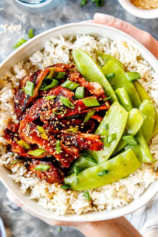 holding a bowl of Korean BBQ Chicken recipe