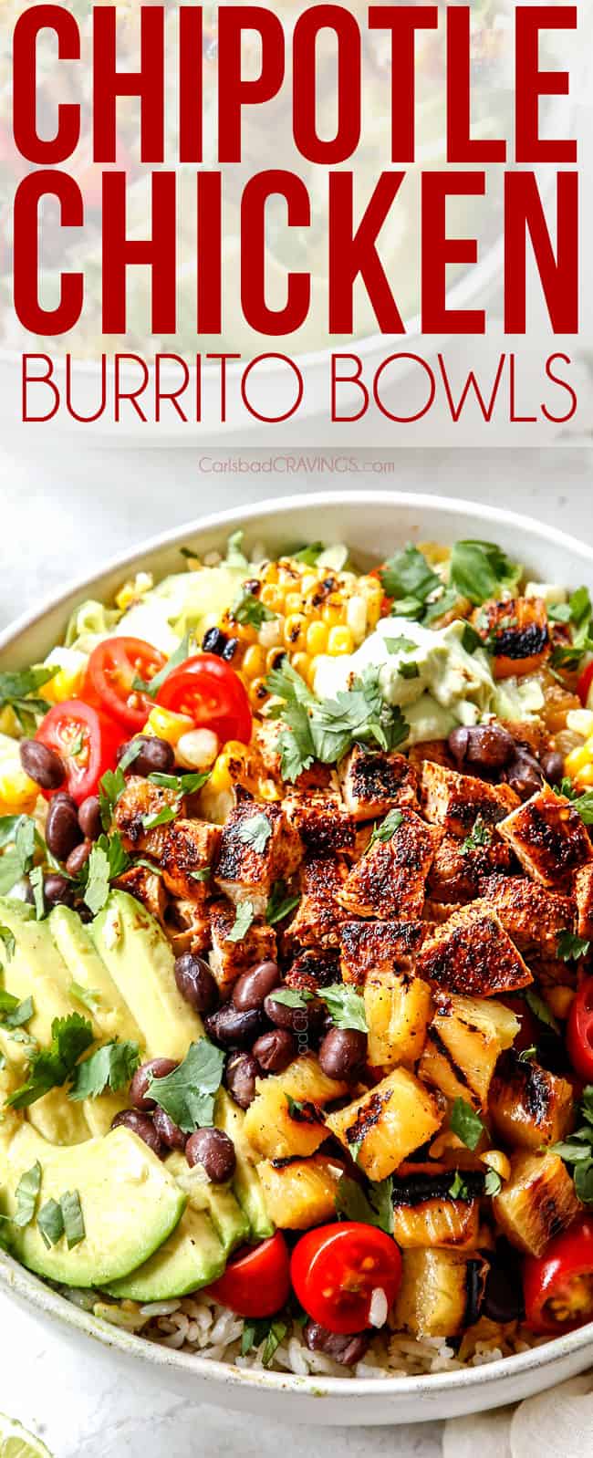 chicken burrito bowl with rice, beans, tomatoes, cheese, avocados