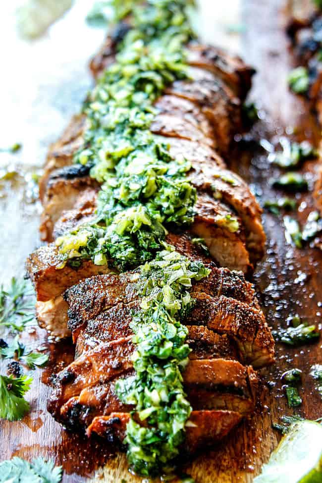 front view of grilled pork tenderloin with chimichurri
