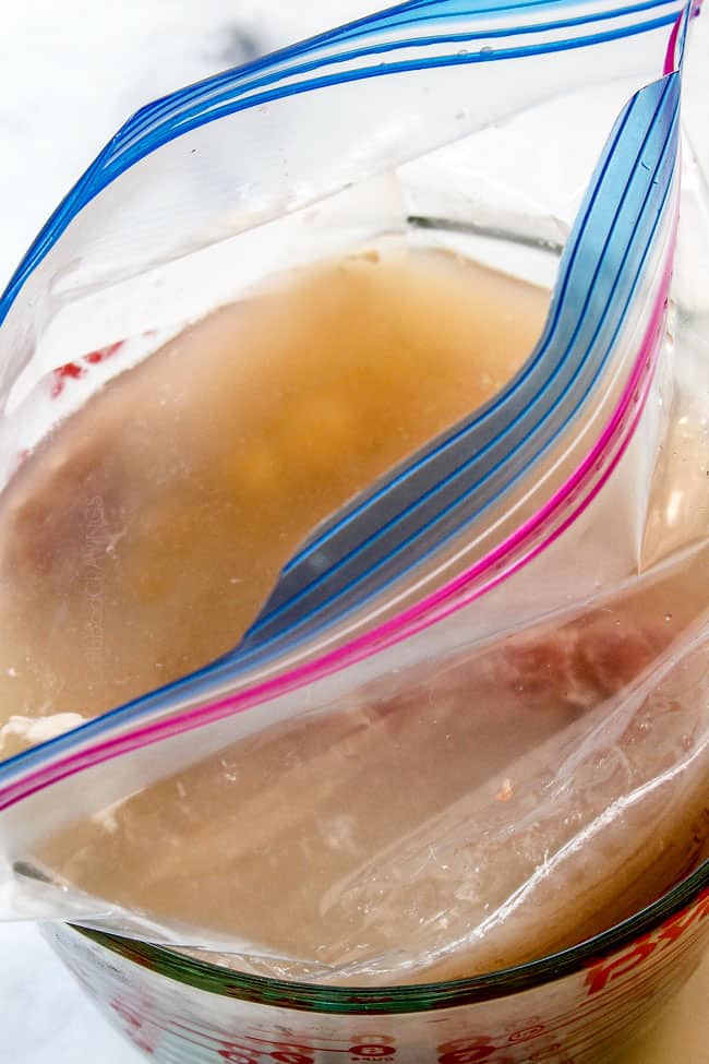 showing how to grill pork tenderloin by adding pork to brine