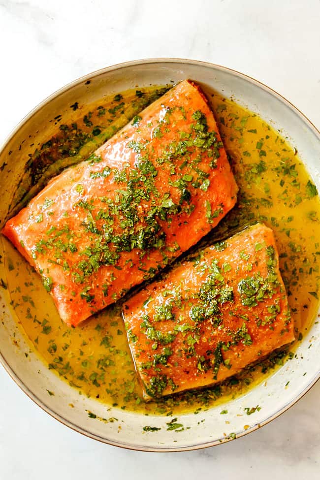 howing how to make salmon bowls by adding salmon to marinade