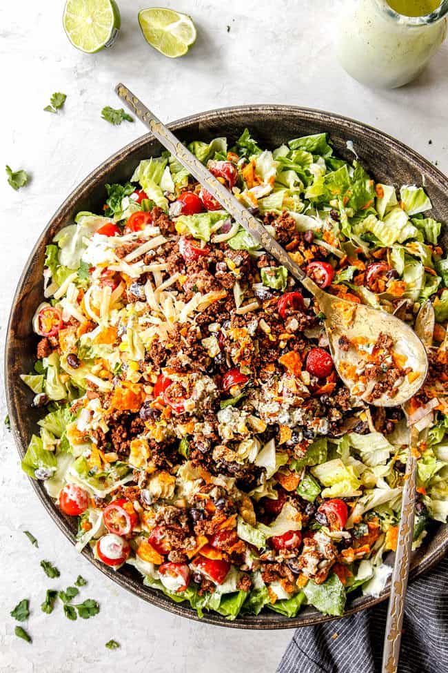 easy taco salad recipe in a large serving bowl tossed together
