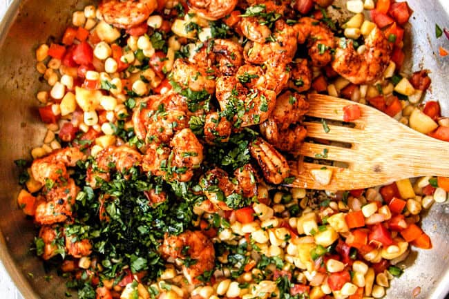 showing how to make stuffed zucchini boats by stirring shrimp, cilantro and vegetables together to make filling