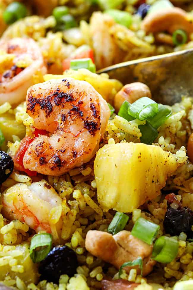 up close of a spoon serving homemade pineapple fried rice recipe