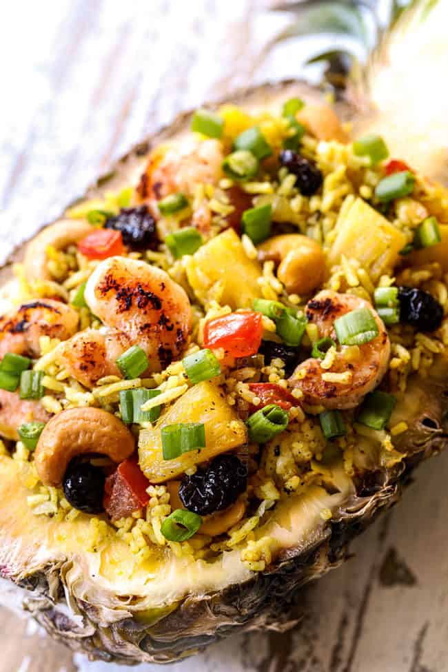 side view of pineapple fried rice in a pineapple for serving