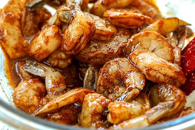 showing how to make shrimp and avocado salad recipe by marinating shrimp