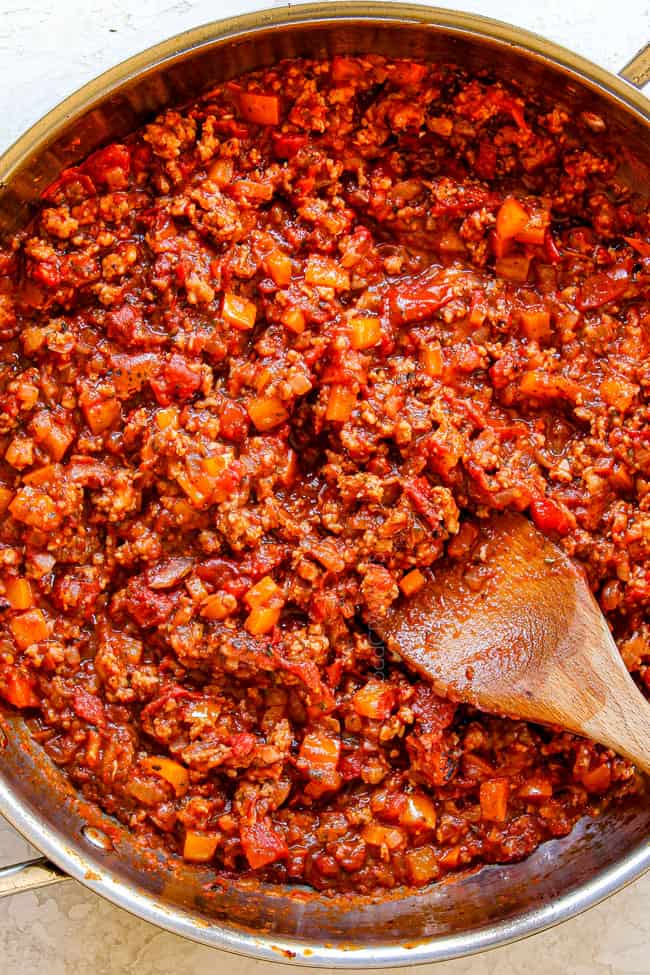showing how to make rigatoni recipe by simmering in a skillet