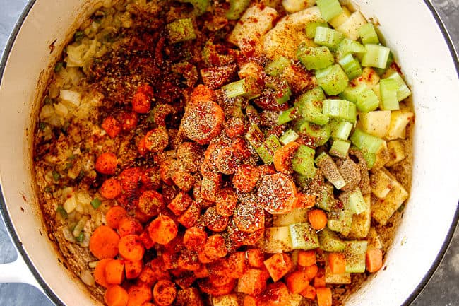 showing how to make Albondigas Soup by adding seasonings to veggies