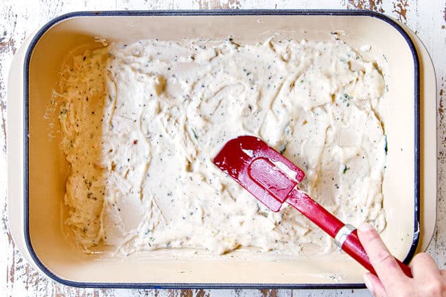 showing how to make white chicken lasagna by layering a 9x13 with Alfredo sauce and chicken