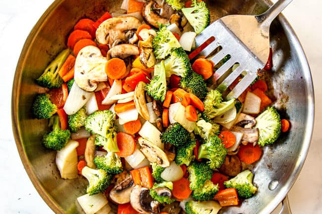 showing how to make easy chicken stir fry recipe by stir frying vegetables