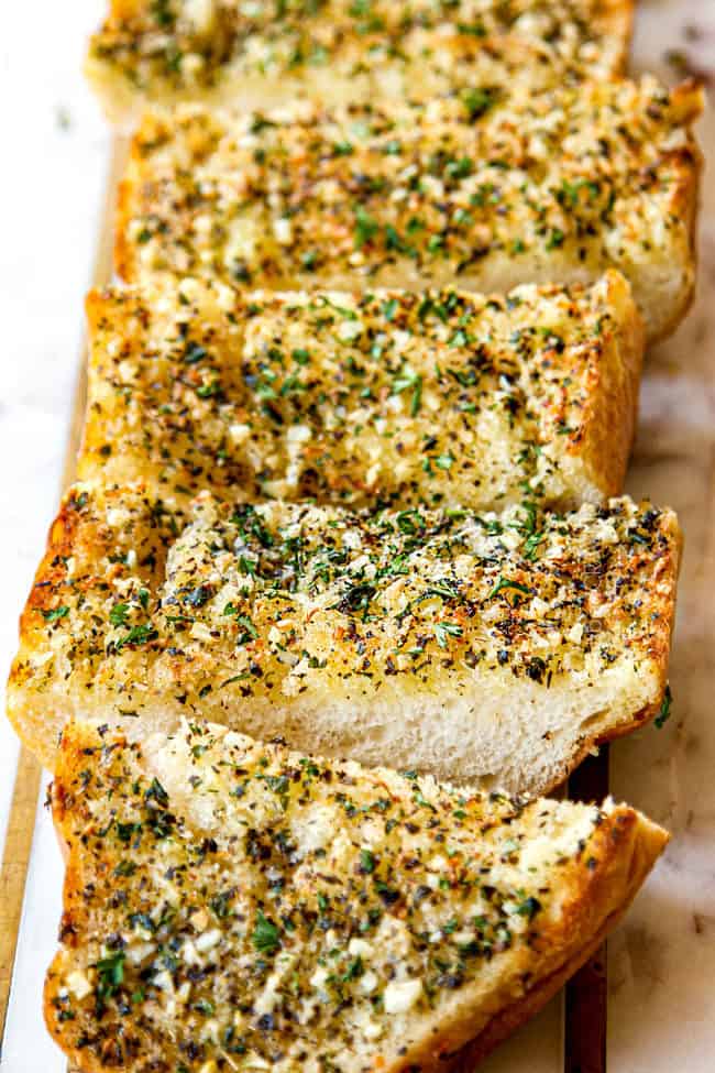 homemade garlic bread on a white cutting board