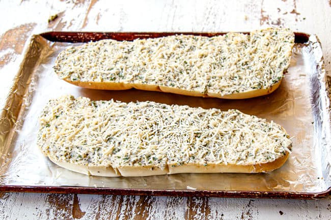 showing how to make cheese garlic bread by topping garlic bread with Parmesan