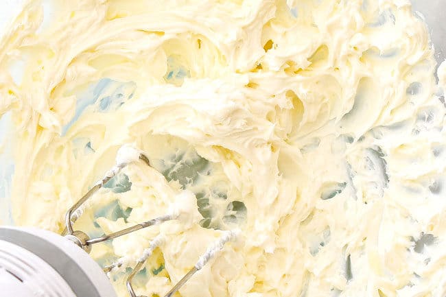 showing how to make peanut butter balls by mixing cream cheese until fluffy