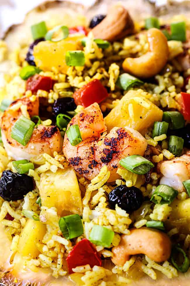 up close of pineapple fried rice in a pineapple boat