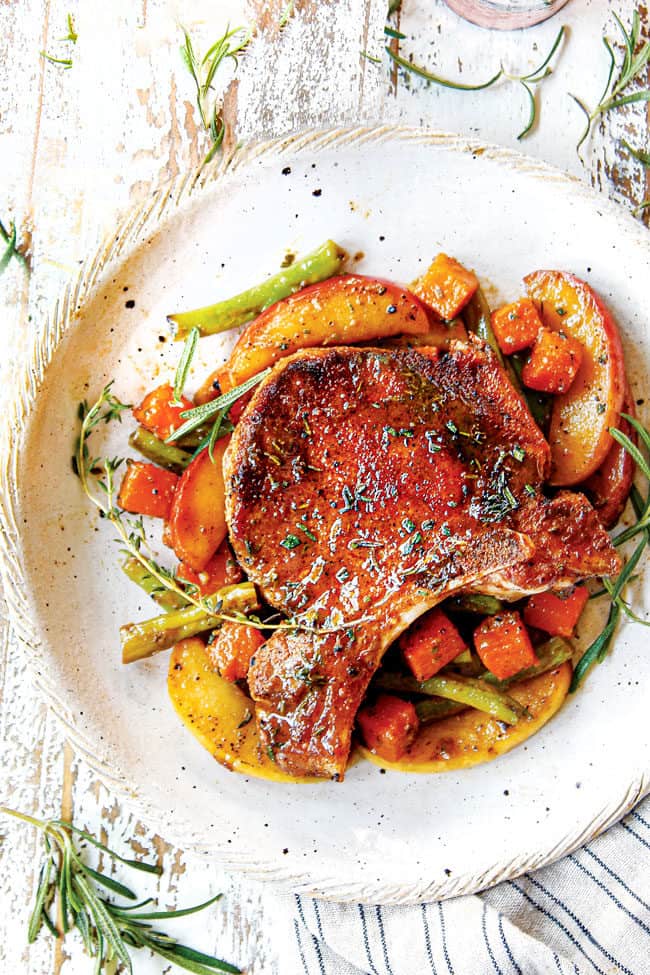 top view of pork chops with apples recipe on a plate