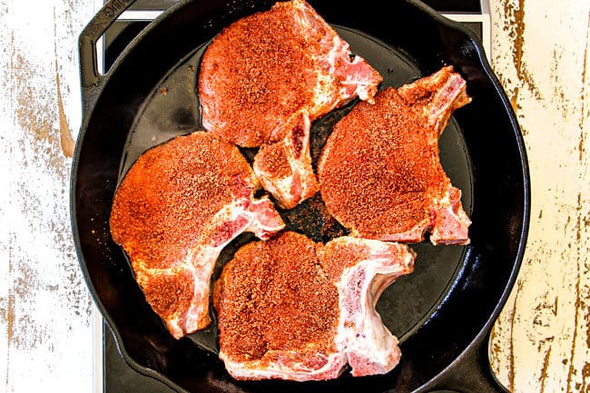 showing how to make pork chops with apples by seasoning pork with a dry rub