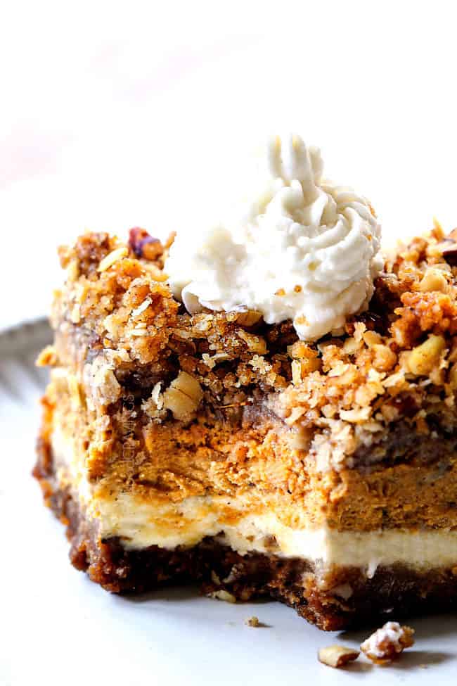 easy pumpkin cheesecake bars with streusel topping with a bite taken out