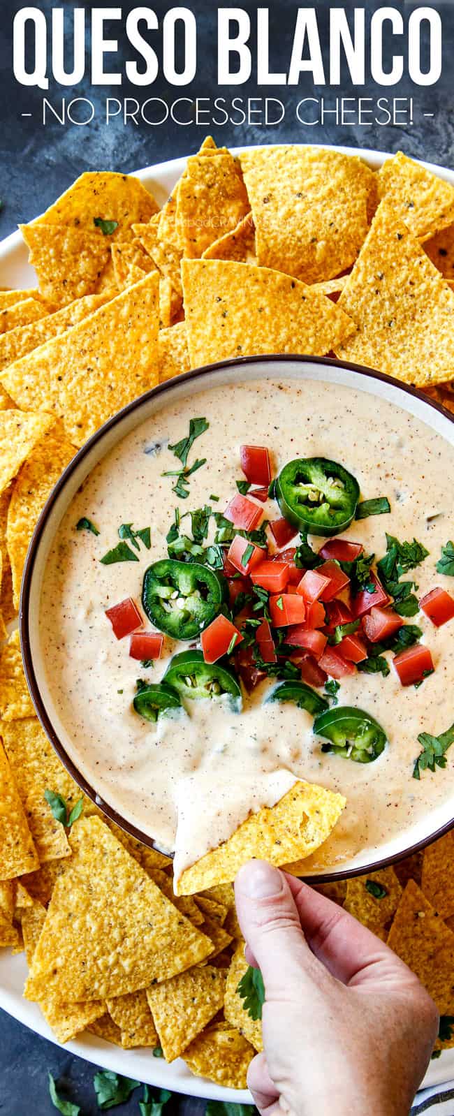 showing how to serve queso blanco by dipping chips into dip