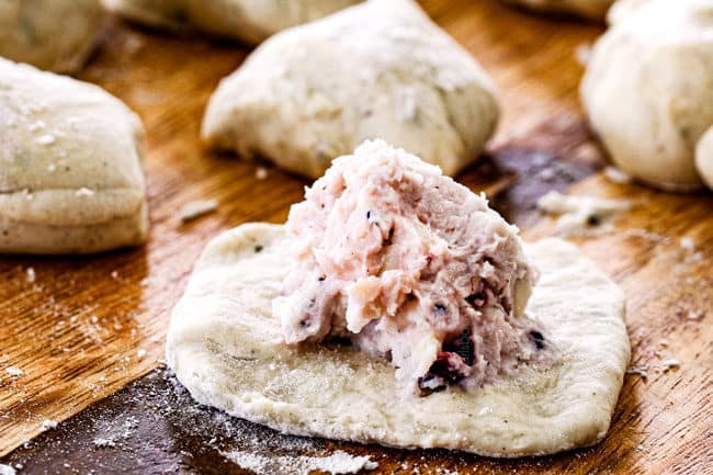 showing how to make leftover turkey recipe by adding leftover turkey to center of dough
