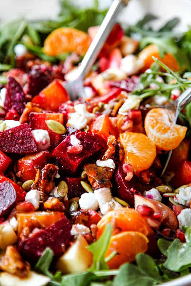showing how to make beet salad by tossing beets with beet dressing