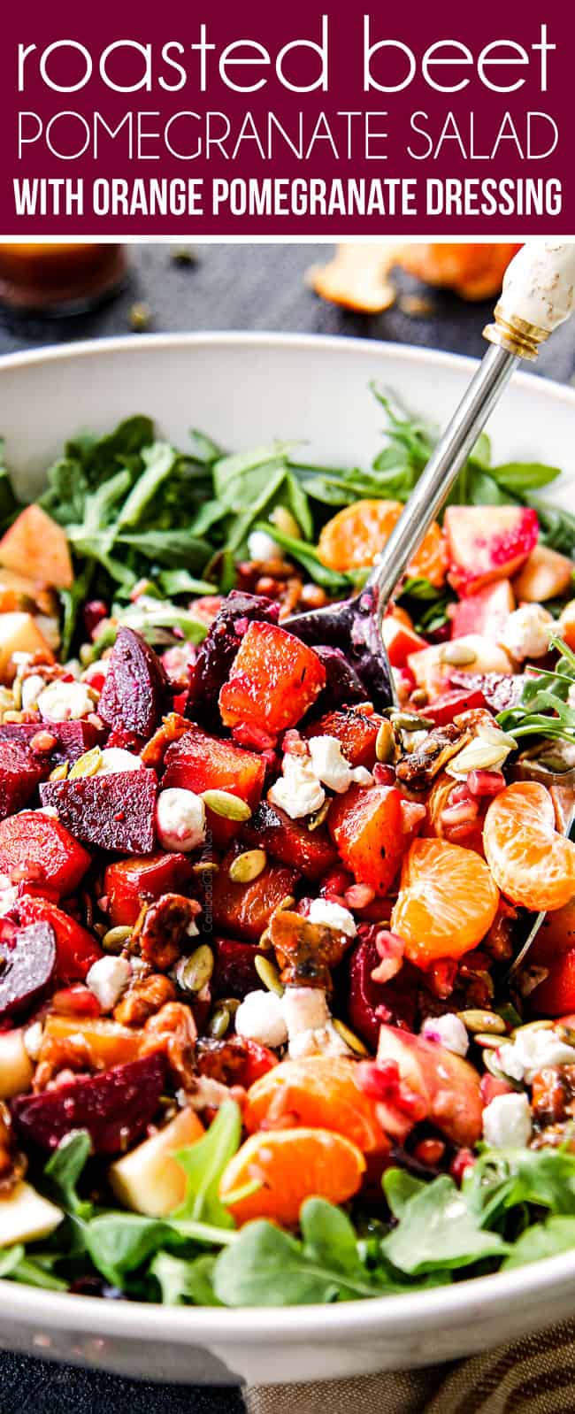 up close of beet salad being tossed with tongs