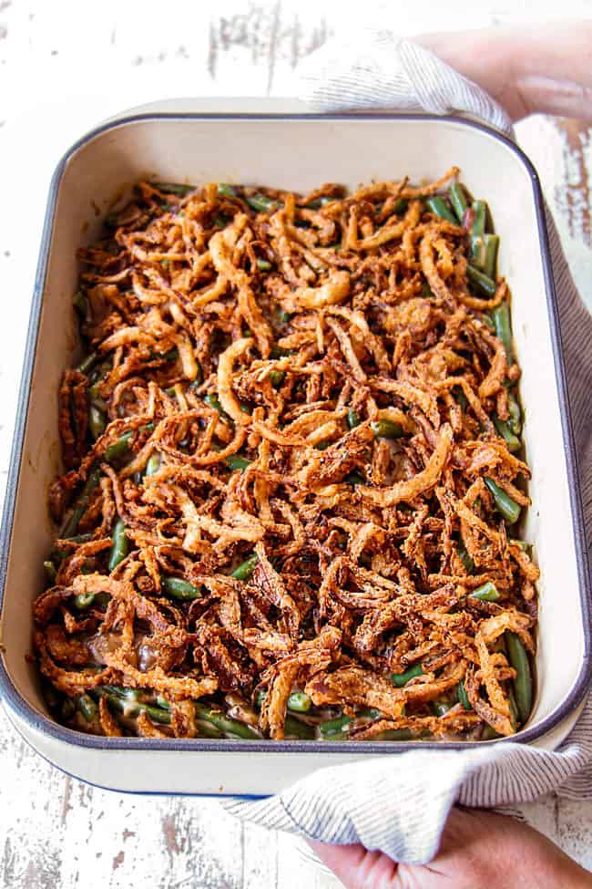 showing how to make fresh green bean casserole by baking until hot and bubbly