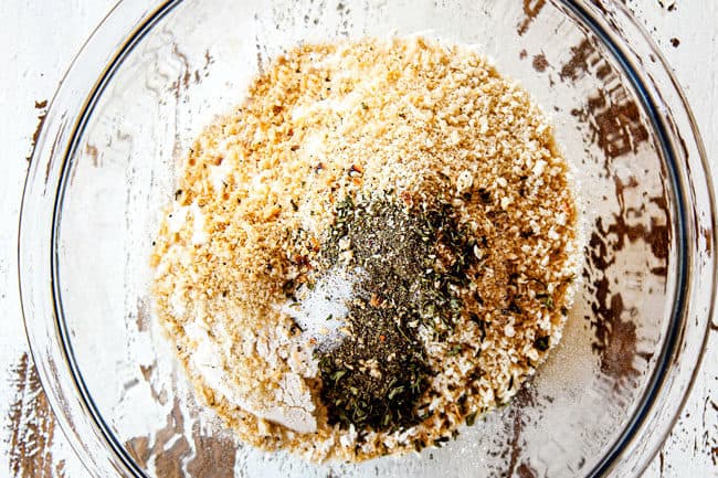 showing how to make BBQ Burgers with fried onion strings by adding flour, panko, salt and pepper to a glass bowl