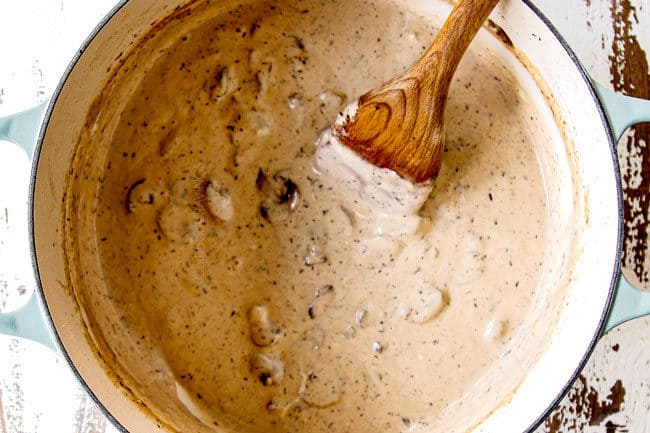 showing how to make green bean casserole from scratch by simmering mushroom sauce until thickened