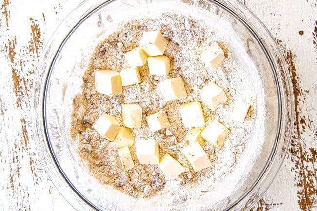 showing how to make Pear Pie by adding butter to topping