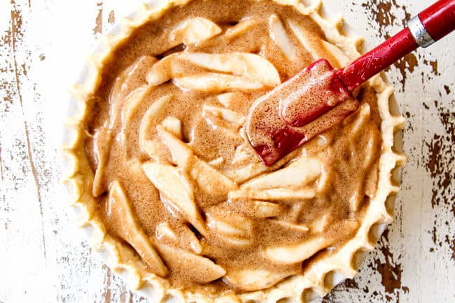 showing how to make pear pie by pouring custard over pear slices