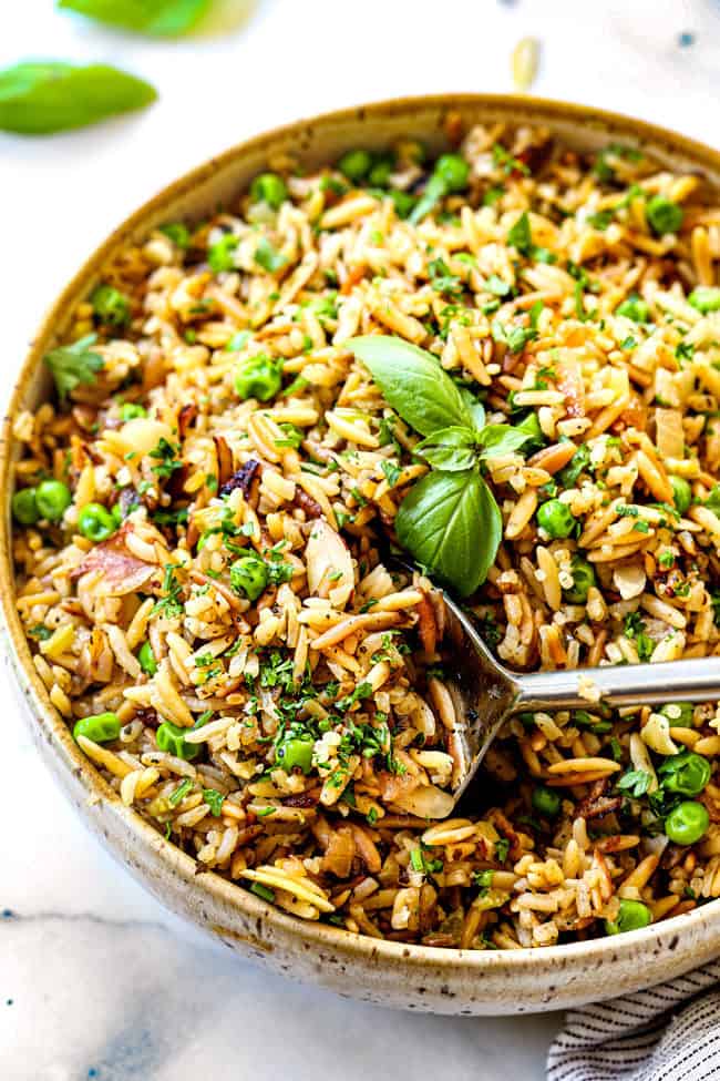 showing how to make rice pilaf by fluffing it before serving