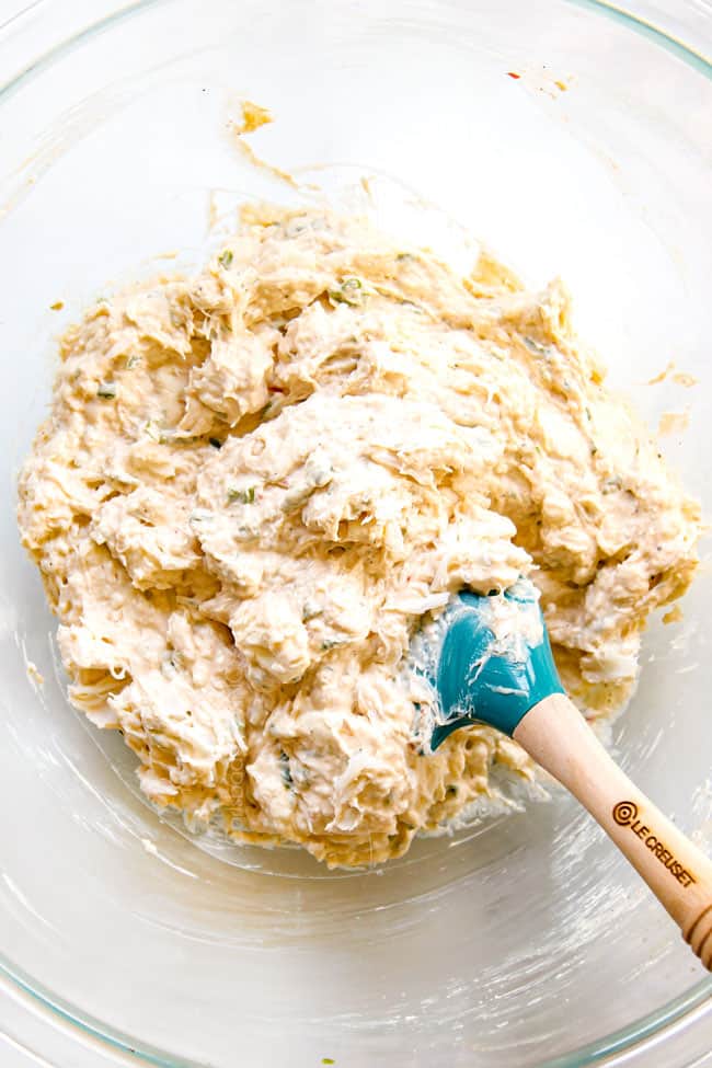 showing how to make crab rangoon by stirring filling until smooth