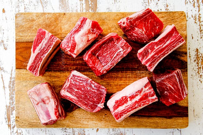 showing what short ribs look like by placing on a cutting board