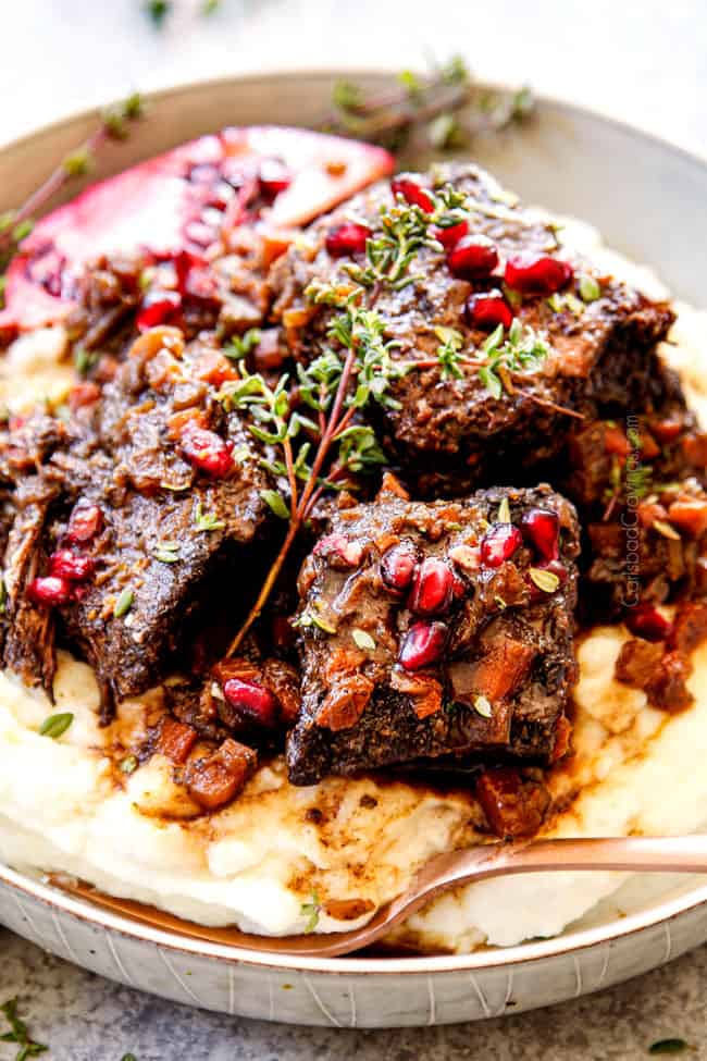 a bowl of short ribs recipe with fall apart tender short ribs