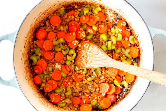 showing how to make best chicken noodle soup by cooking carrots, onions and celery together