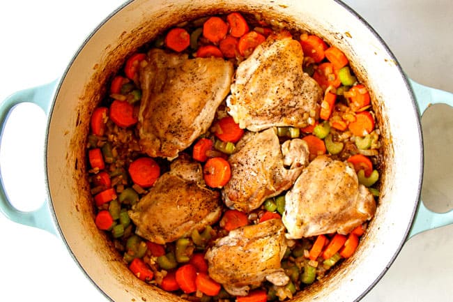 showing how to make chicken noodle soup by adding chicken to vegetables