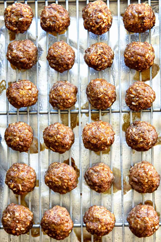 showing how to make best cocktail meatballs by baking meatballs until cooked thorough