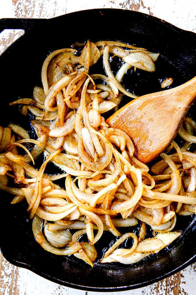showing how to make egg frittata recipe by cooking onions in a cast iron skillet