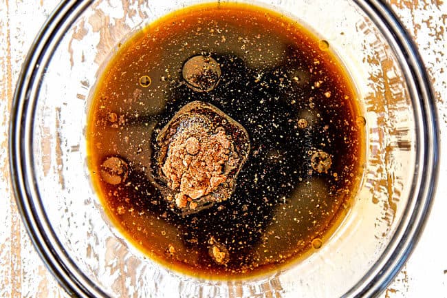 showing how to make Szechuan chicken by whisking Szechuan Sauce ingredients together in a glass bowl