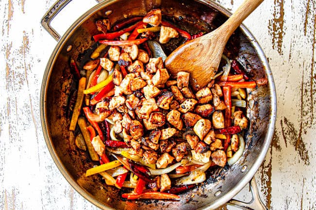 showing how to make Szechuan chicken by adding chicken and Szechuan sauce to vegetables