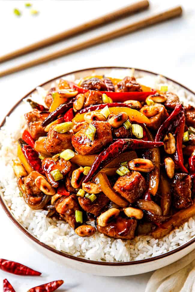 showing how to customize the heat of Szechuan chicken by adding Thai chili seeds