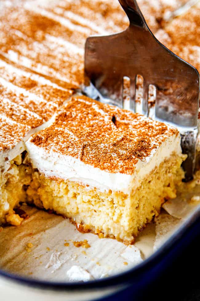 showing how to serve authentic tres leches cake by removing from pan with a spatula